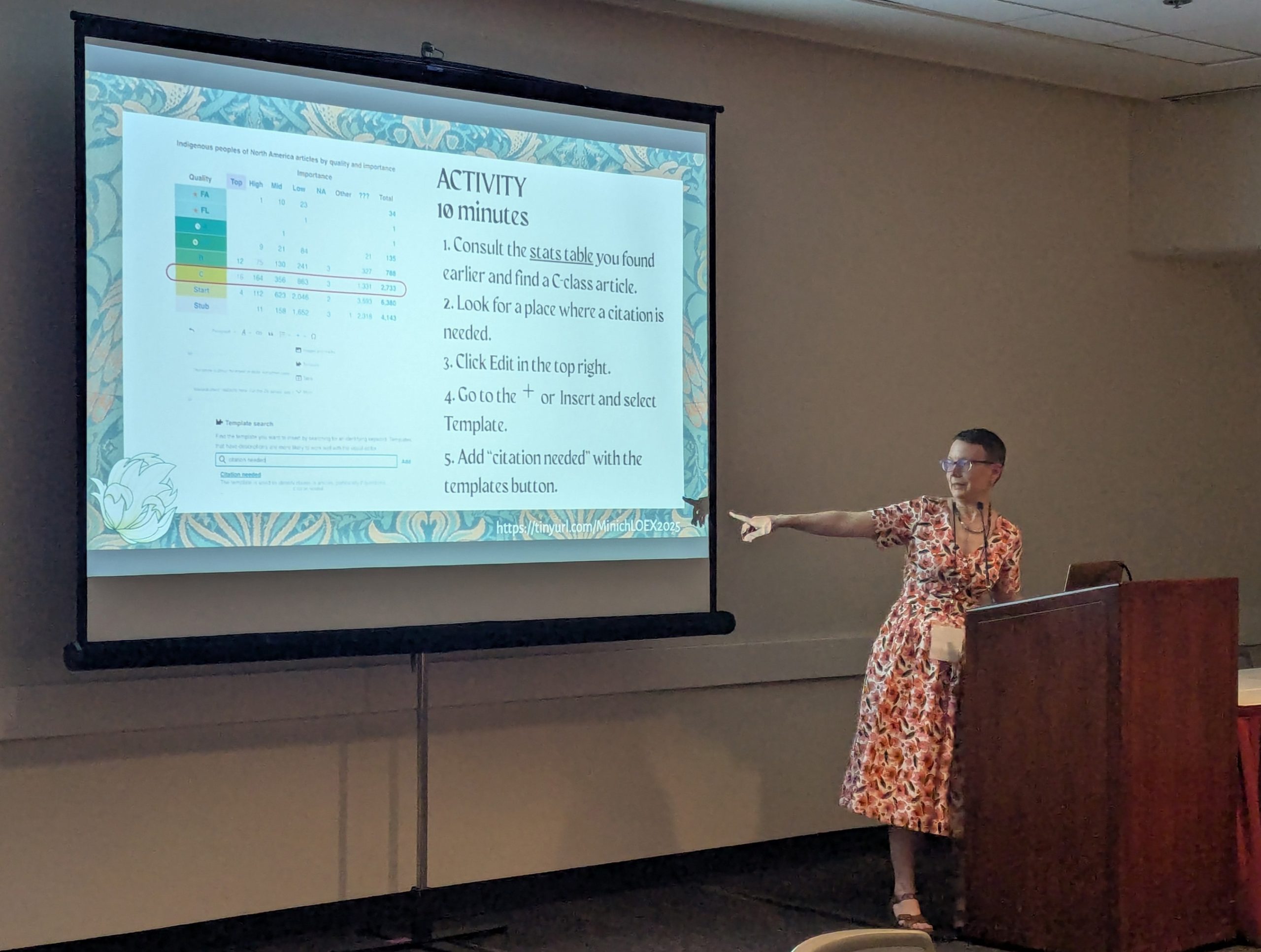 Linnea Minich points at a slideshow during her presentation